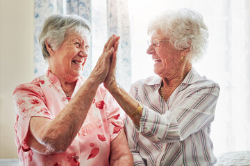 Happy, love and senior women with a high five for care, retirement support and happiness. Smile, team and elderly friends with excited gesture for solidarity or lifestyle in a nursing home together