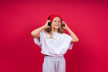 Child music concept. Teenager girl dances in rhythm of melody, listens song in headphones