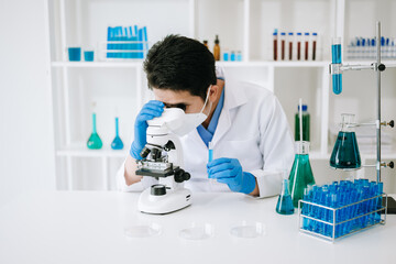 Scientist mixing chemical liquids in the chemistry lab. Researcher working in the chemical a...