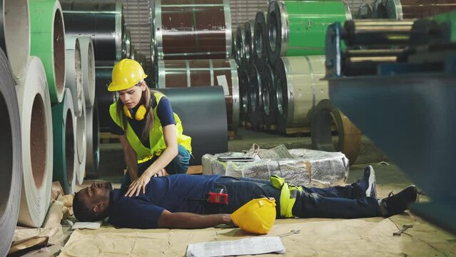 Emergency on worker in factory, First aid emergency CPR on heart attack Man , One part of the process resuscitation - Healthcare concept.