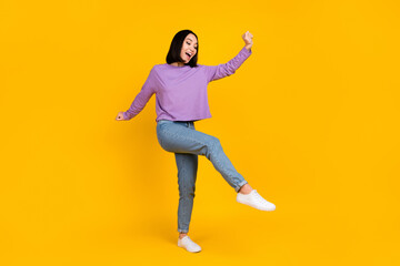 Fototapeta na wymiar Full size photo of good mood optimistic girl bob hairdo violet shirt pants dancing having fun isolated on yellow color background
