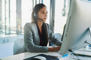 Call center, computer and consulting with woman in office for customer support, advisory and online. Technology, internet and receptionist with employee at desk for contact us, communication and crm