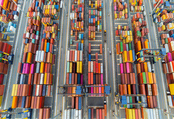 cargo ship and truck at seaport waiting for container dock crane shipment harbor loading container...