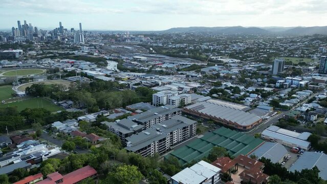 Establishing drone shot of Brisbane City taken from above Albion Windsor area, looking towards Brisbane City with Albion Park Paceway, Brisbane River, ICB and surrounding suburbs in shot.