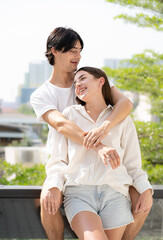 Romantic young couple in love happy romance relationship together. Portrait of handsome man tenderly embracing his beautiful girlfriend with affection. Lover enjoying valentine, honeymoon or dating.