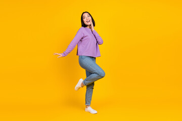 Fototapeta na wymiar Full body cadre of young japanese girl dancing stylish outfit have fun chill trendy outfit promo banner isolated on yellow color background