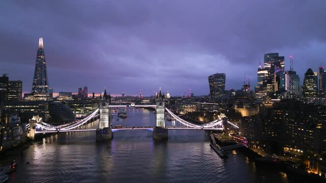Aerial view of Tower Bridge, The Shard and City of London skyline at sunset, England