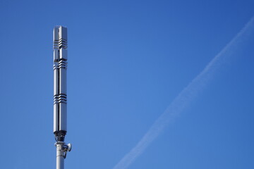 Obraz premium Telecom Tower Clear Blue Sky Background