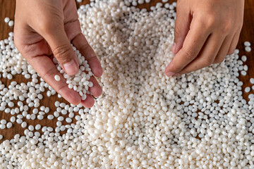 White plastic grain, plastic polymer granules,hand hold Polymer pellets, Raw materials for making water pipes, Plastics from petrochemicals and compound extrusion, resin from plant polyethylene.