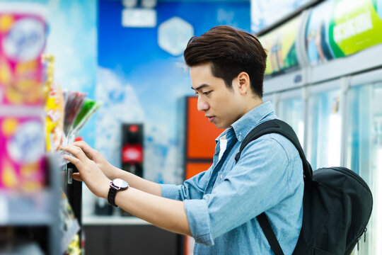 image of Asian man shopping at a convenience store