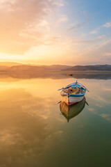 beautiful landscape with a boat and the sun