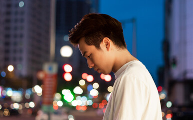 Asian man portrait in the street at night