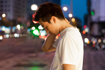 Asian man portrait in the street at night