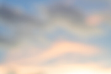 Blurred natural background texture of beautiful sky light with strange clouds in the morning or evening taken at the sea.Sun is setting or rising at the sea