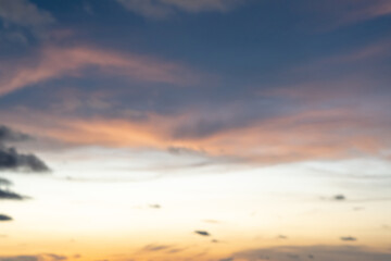 Blurred natural background texture of beautiful sky light with strange clouds in the morning or evening taken at the sea.Sun is setting or rising at the sea