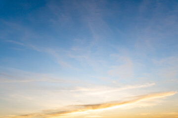 Beautiful blue and yellow sky with strange clouds in the morning or evening taken at the sea