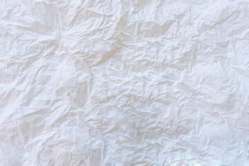Wrinkled or crumpled white stencil paper or tissue after use in toilet or restroom with large copy space used for background texture in decorative art work