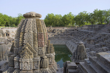 Small shrines and steps to reach the bottom of the reservoir, of the Sun Temple. Modhera village of...