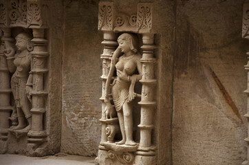 Carving details of an idol of apsara, located on the inner wall of Rani ki vav, an intricately...
