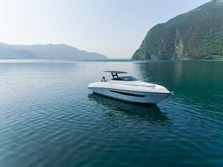 Obraz premium young amazing woman relax on the yacht, aerial view