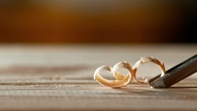 Super slow motion of detail of carving wood with a chisel. Low depth of focus, super macro shot. Filmed on high speed cinema camera, 1000 fps.