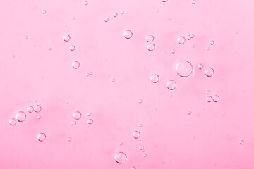 Cosmetic gel, serum transparent sample. Liquid cream with bubble texture. Gel texture of a cosmetic product. Clear liquid lotion for skin care.