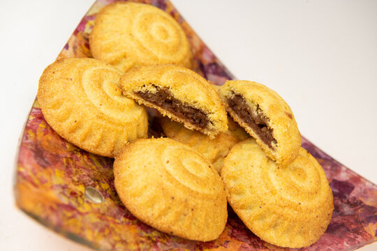 Traditional eid maamoul or mamoul cookies with dates, nuts, and jam, Arabic sweets for Aid al-Fitr and easter, High quality photo