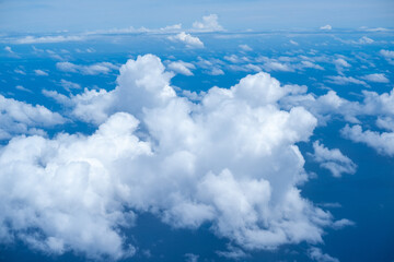 Obraz premium Beautiful cloud view from airplane, sky and clouds from a airplane window, Beautiful view of cumulus clouds with sunny day atmosphere
