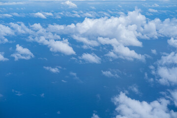 Beautiful cloud view from airplane, sky and clouds from a airplane window, Beautiful view of cumulus clouds with sunny day atmosphere