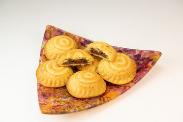 Traditional eid maamoul or mamoul cookies with dates, nuts, and jam, Arabic sweets for Aid al-Fitr and easter, High quality photo