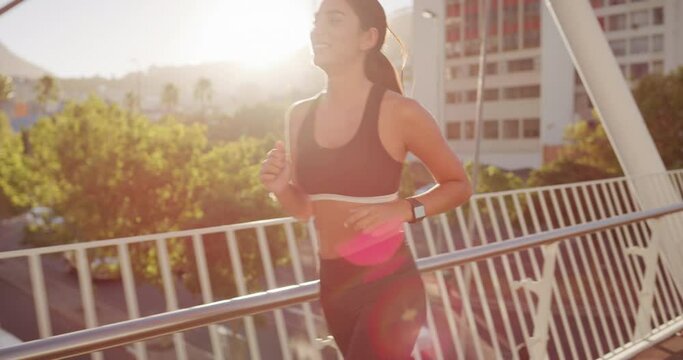 Fitness, running and woman in city for body training, exercise and cardio wellness on bridge with outdoor challenge. Runner, athlete or young sports person, health workout and energy in lens flare