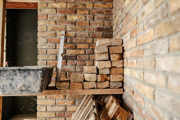 Bricks on a pile on a house in building process.