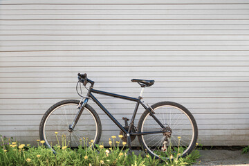 Fototapeta na wymiar Modern sport mountain bike leaning wall. Active lifestyle.