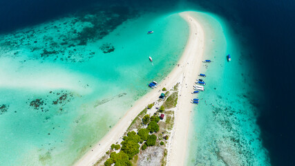 Top view of beautiful Sibuan island with a beach and a coral atoll. Tun Sakaran Marine Park....