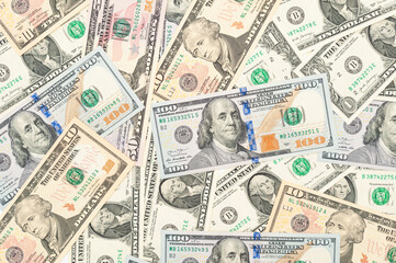 Scenes of Abundance: A Visual Composition with Scattered 1, 10, 50, and 100 Dollar Bills