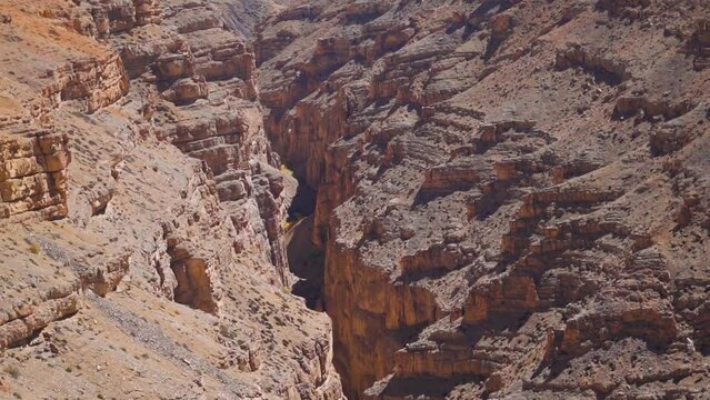Landscape shot of a canyon between the two mountains as seen on the way to Komic village in Spiti Valley, Himachal Pradesh, India. View of canyon in between the Himalayan mountains in Spiti Valley.