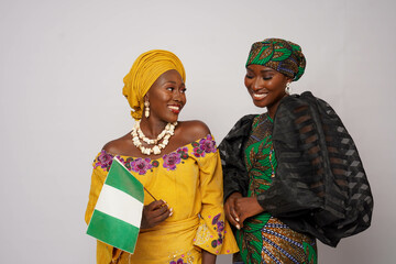 Happy Nigerian women dressed in traditional dress.