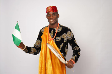 portrait of Happy African man dressed in traditional Ibo attire.