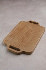 Wooden cutting board on the table, isolated