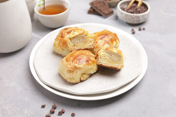 Pastry product with banana filling on a plate