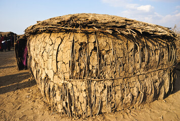 An old hut made of clay and twigs The house is made of clay in Kenya,Africa.