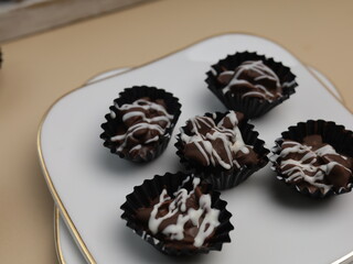 Mini chocolate cereal for treats on white plate