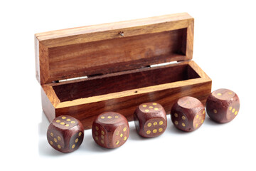 The old wooden dice isolated on a white background.