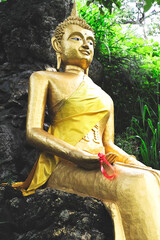 The Golden Buddha statue is a sacred symbol of Buddhism and  general attraction in peaceful Thailand.