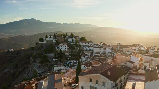 Aerial drone shot of a classic white Andalusian village Comares located on a mountain top near Malaga.