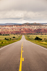 Fototapeta na wymiar The road on the red mountains in The Ghost Ranch, New Mexico