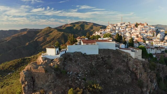 Aerial drone shot of a classic white Andalusian village Comares located on a mountain top near Malaga.