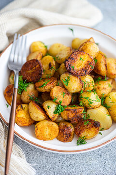 Spring potato in dish on grey background