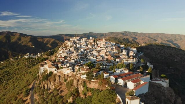 Aerial drone shot of a classic white Andalusian village Comares located on a mountain top near Malaga.