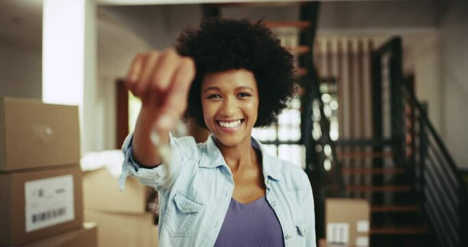 Woman, keys and new home owner happy about moving into her first house or apartment. Portrait of excited female with a smile and key for property or real estate with mortgage, housing loan and pride